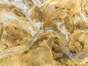 Steaming hot springs and colourful rhyolite mountains, aerial view, Hveradalir geothermal area,