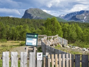 Start of hiking path Hulderstigen, upper valley of river Sjoa, bridge over the river, Jotunheimen,