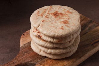 Pita bread, stack, on the table, no people