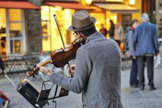 Florence, Italy-June 16, 2017: Street musicians entertaining tourists near landmark Florence