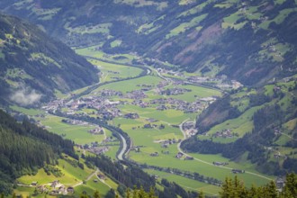 Green valley with village and river in the Alps, surrounded by mountains, Mayrhofen, Zillertal.