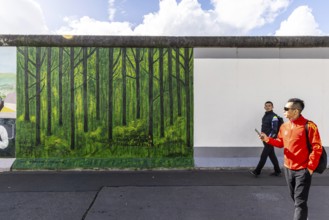 East Side Gallery. Remnant of the Berlin Wall, designed by artists. Landmark and city view Berlin,