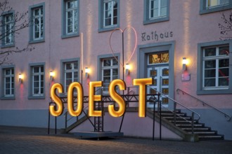 Illuminated town hall in the early evening at the Winterstrahlen Festival of Lights in Soest, North