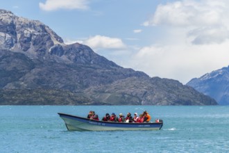 Excursion boat with tourists in front of the marble caves Capillas de Marmol, Lago General Carrera,