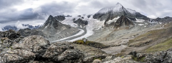 Mountain hut Cabane des Dix in front of glacier Glacier de Cheilon and summit Mont Blanc de