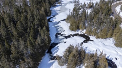 Wolf river. Frozen river in winter. Mastigouche wildlife reserve. Province of Quebec. Canada