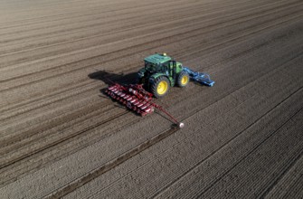 Sugar beet being sown in spring, precision sowing with precision seed drill, behind a tractor,