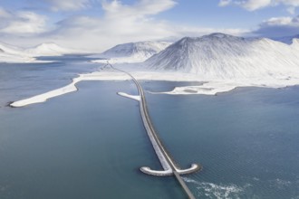 Aerial view over Sword bridge in winter, road bridge over Kolgrafafjörður in the north of the