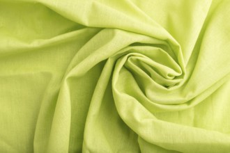 Fragment of green linen tissue. Top view, flat lay, natural textile background and texture. wave
