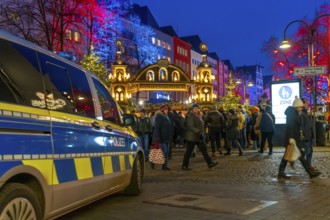 Police patrol car in front of the Christmas market on the Alter Markt in the old town of Cologne,