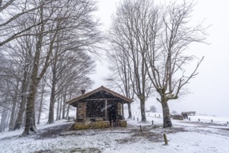 Beautiful refuge of the aizkorri mountain in gipuzkoa. Snowy landscape by winter snows. Basque