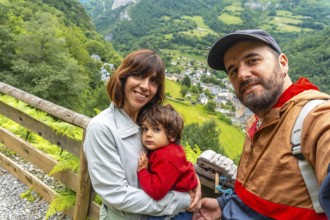 A family on a trail having fun in a Borce commune in the French Pyrenees and its beautiful