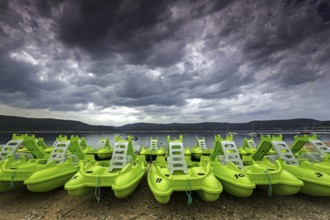 Pedal boats on the beach in Sainte Croix du Verdon, Lac de Sainte-Croix, thunderstorm atmosphere,