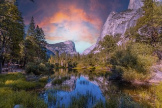 Reflections in the water of the Yosemite Mountains at Mirror Lake at sunset, Yosemite. California,