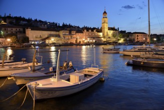 Fishing boats in the harbour of Sutivan front of the Sveti Ivan Church, Sutivan, Island Brac,
