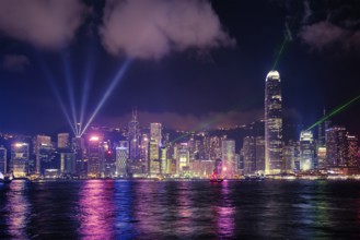 Hong Kong skyline cityscape downtown skyscrapers over Victoria Harbour in the evening illuminated