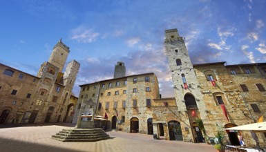 Medieval buildings of Piazza della Cisterna, San Gimignano, Tuscany Italy