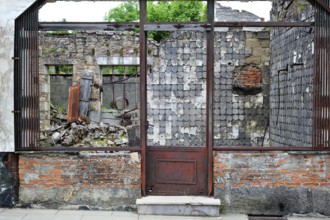 Burnt-out butcher's shop. The burnt village of Oradour-sur-Glane was destroyed on 10 June 1944 when