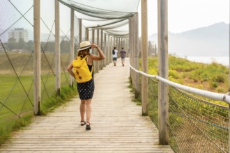 Summer vacation lifestyle. Young and adventurous girl enjoying the summer walking alone along the