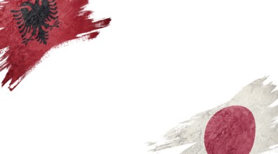 Flags of Albania and Japan on white background