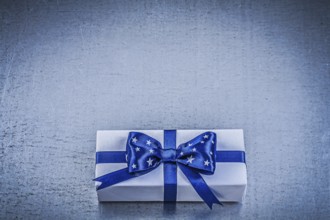 Packed box-container on metallic background celebrations concept