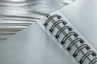 Spiral notebook on white wooden board