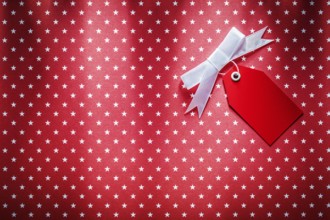 Sale tag on red fabric shopping concept