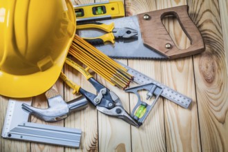 Tools and helmet on wooden boards
