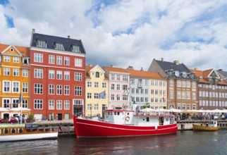 COPENHAGEN, DENMARK, JULY 31, 2016: Summer view of the famous Nyhavn with its colorful buildings