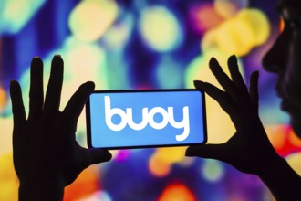 In this photo illustration the Buoy Health logo seen displayed on a smartphone