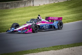 HELIO CASTRONEVES (66) of Sao Paulo, Brazil practices for the XPEL Grand Prix at Road America in