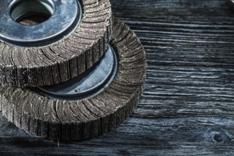 Used grinding discs on vintage wooden board