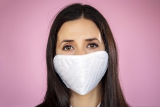 Young woman wearing a protective face mask during the Coronavirus disease COVID-19 outbreak