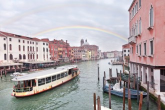 Grand channel in Venice with sailing motor boats and building exteriors