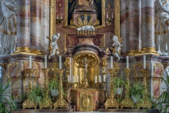 Main altar with candles and tabernacle, St George and Florian is a listed Catholic parish church in