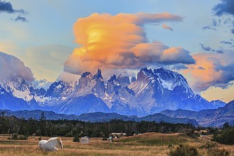 Incredible clouds illuminated by the sunset. The granite towers of Cuernos del Paine. White