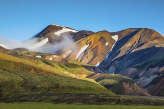 Early summer morning in the National Park Landmannalaugar, Iceland. In the hollows of rhyolitic