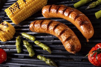 Grilled krakauer with french fries and green salad