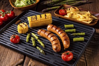 Grilled krakauer with french fries and green salad