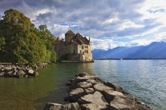 Lake in the mountains. Cold sunset Lake Geneva in the fall on sunny day. Montreux, Switzerland,