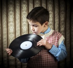 Child hold lp. Vontage clothes