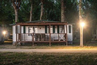 Wooden bungalow in camping at night