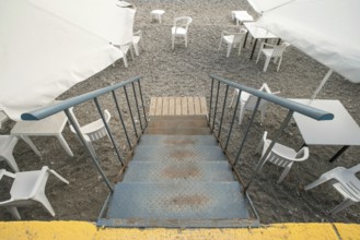 Bar on the beach. White chairs