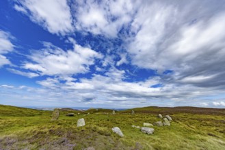 Druids Circle, stone circle in wide landscape with pastures in the mountains, Penmaenmawr,