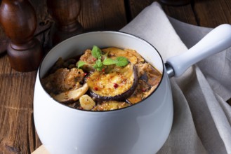 Veal goulash with baked aubergine and herbs