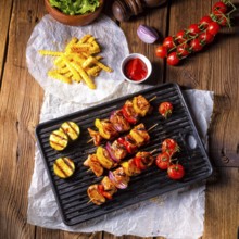 Rustic shish kebab skewers with marinated ham meat paprika and red onion
