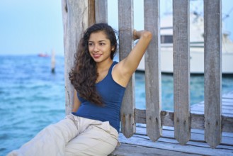 Mexican latin woman relaxed at Caribbean sea of Riviera Maya in Mexico
