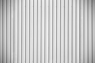 Close-up of the corrugated metal wall of a construction container