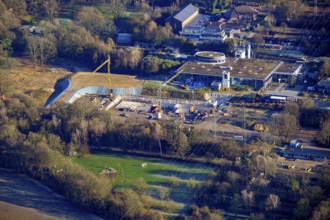Construction site for the modernisation, renovation and conversion of the swimming pool at the