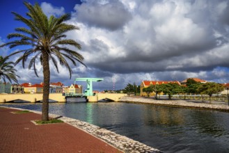 A view of a bridge in willemstad on curacao with blue sky and beautiful clouds